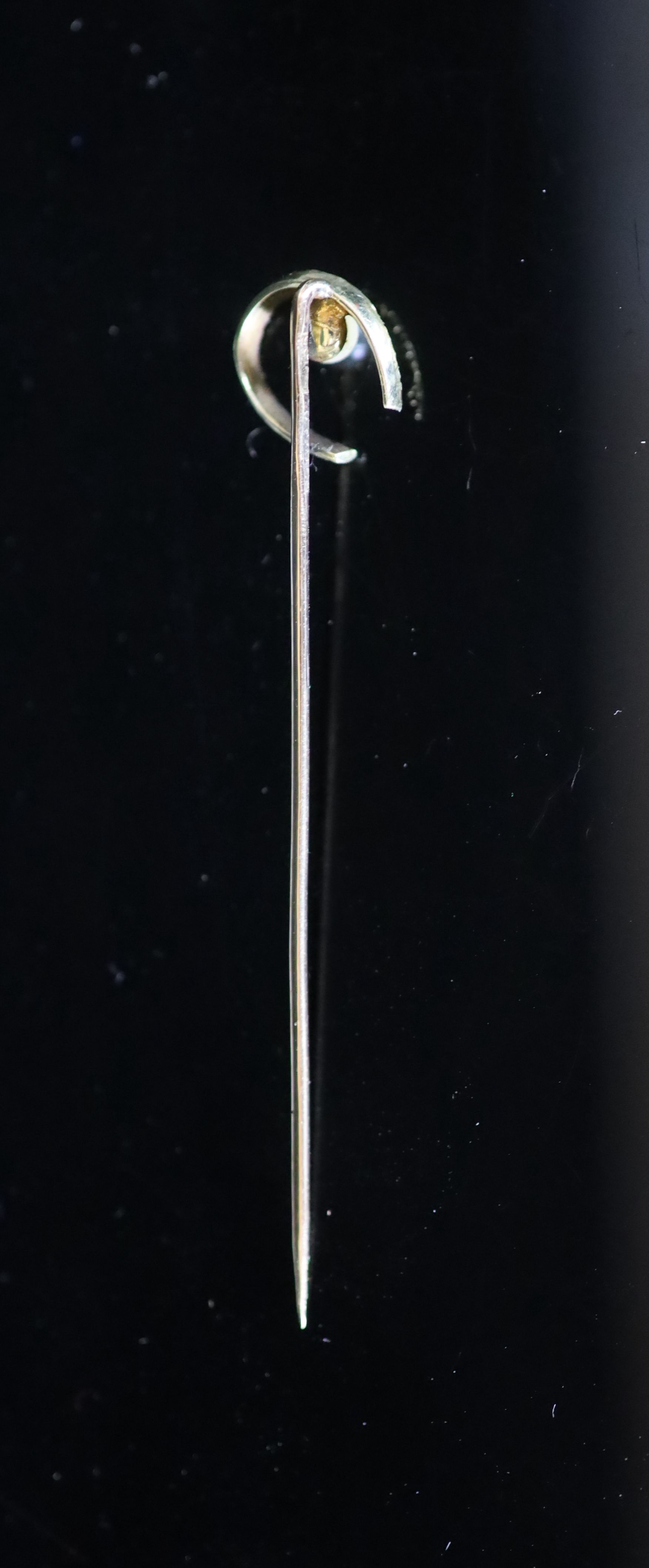 An early 20th century Russian 56 zolotnik gold and seed pearl set horseshoe stick pin by Faberge